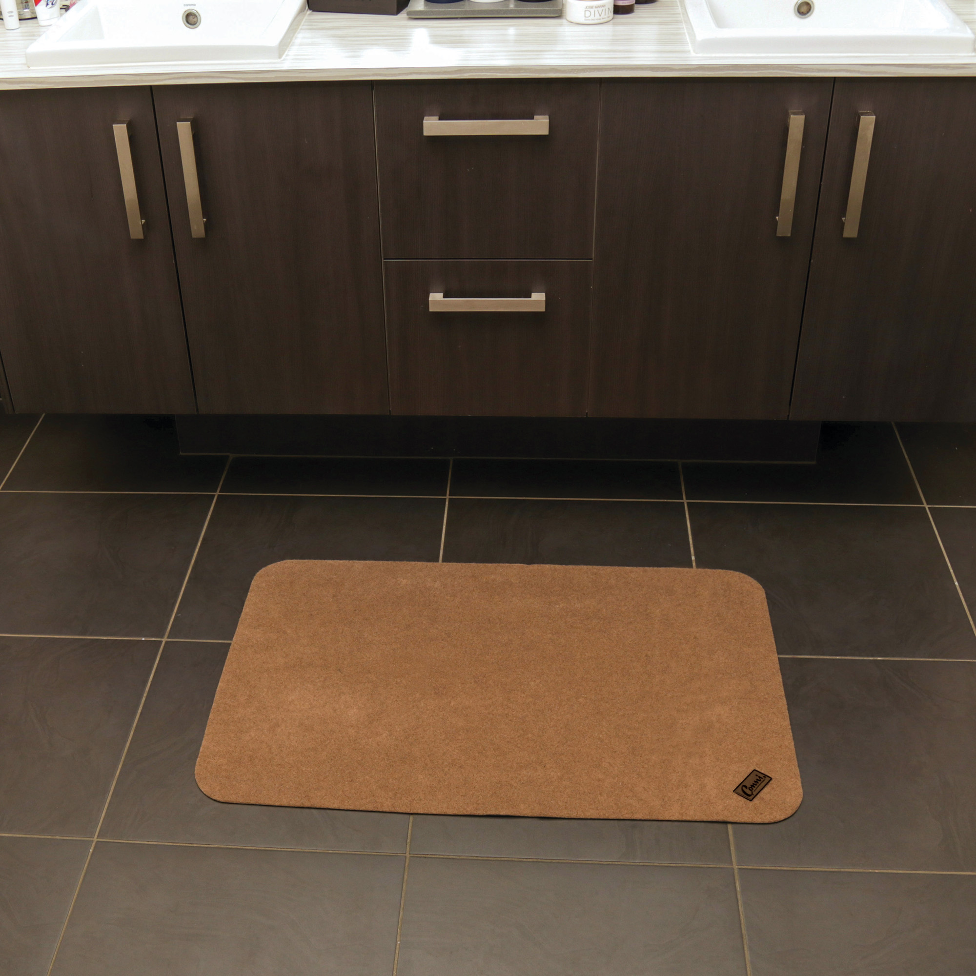 Conni Pebble Floor Mat at bathroom sink